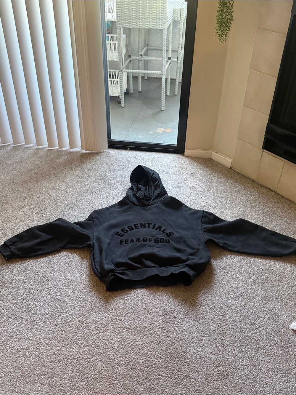 Fear of God Essentials Black Hoodie with Embossed Logo
